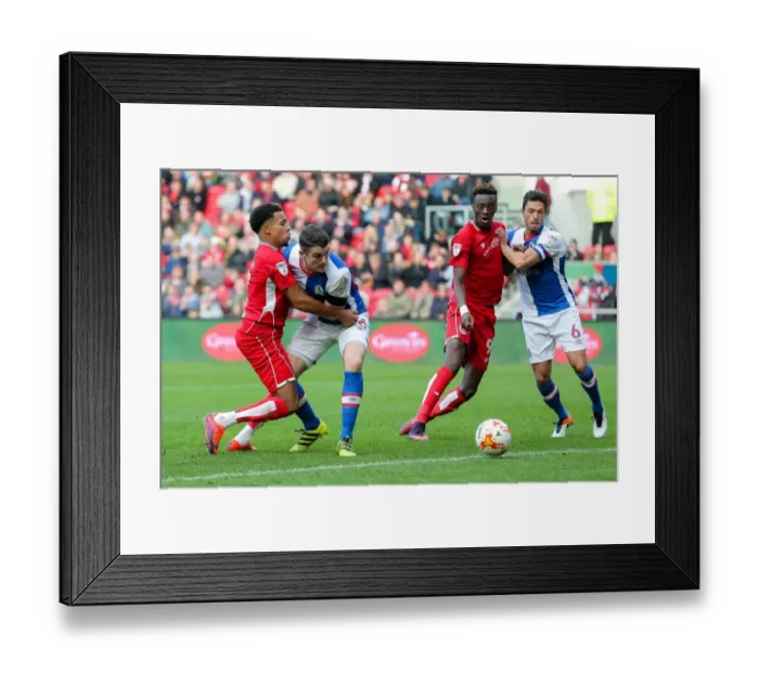 Framed Print : Intense Rivalry: Players Clash in Bristol City vs. Blackburn Rovers Championship Match