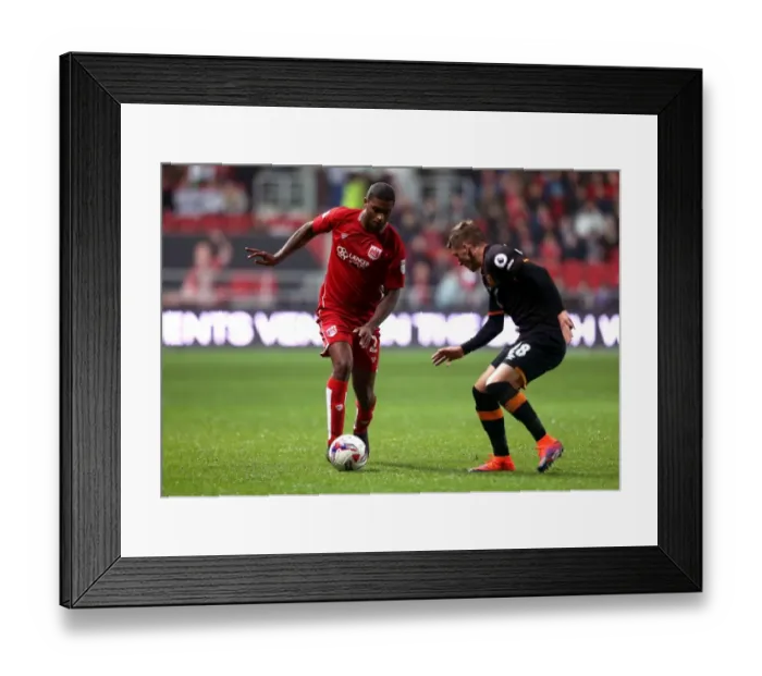 Framed Print : Mark Little vs Josh Tymon: Clash at Ashton Gate - EFL Cup Showdown