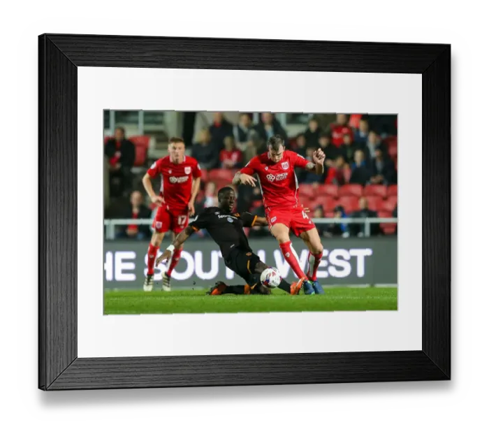 Framed Print : Aden Flint vs Adama Diomande: Intense Battle in Bristol City vs Hull City EFL Cup Clash