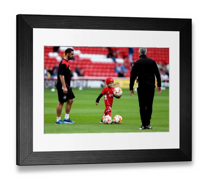 Framed Print : Young Bristol City Fan Invited onto Oakwell Pitch to Help Collect Footballs for Warm-Up
