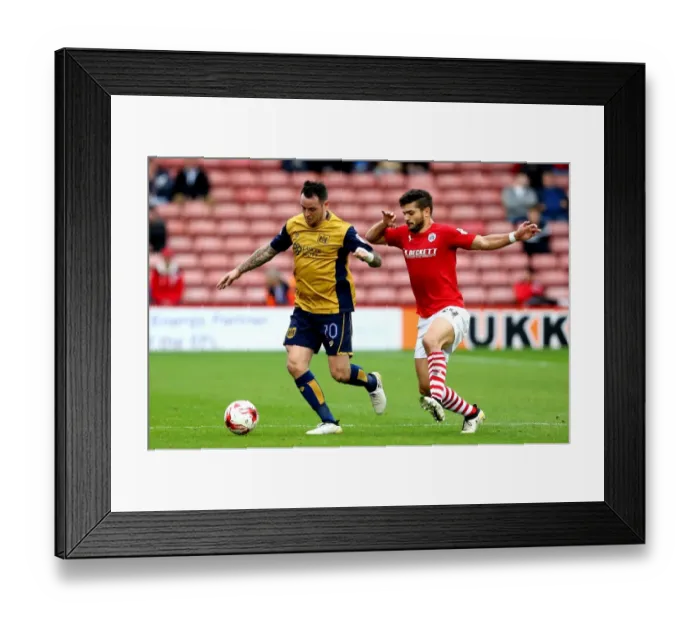 Framed Print : Bristol City's Lee Tomlin Faces Off Against Barnsley's Sam Morsy in Sky Bet Championship Clash Framed Print : Bristol City's Lee Tomlin Faces Off Against Barnsley's Sam Morsy in Sky Bet Championship Clash