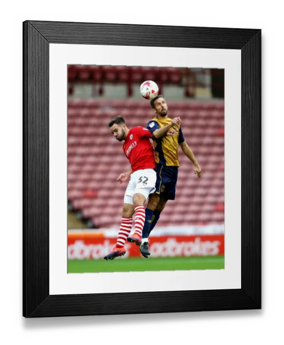 Framed Print : Gary O'Neil Wins Heading Duel Over Adam Armstrong in Barnsley vs. Bristol City Championship Clash