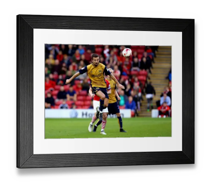 Framed Print : Gary O'Neil Clears the Ball for Bristol City against Barnsley at Oakwell Stadium, 2016