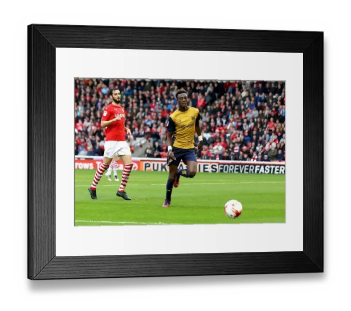 Framed Print : Chasing Glory: Tammy Abraham in Pursuit at Oakwell Framed Print : Chasing Glory: Tammy Abraham in Pursuit at Oakwell