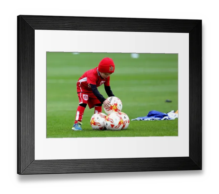 Framed Print : Young Bristol City Fan Helps Out at Barnsley's Oakwell Stadium during Match