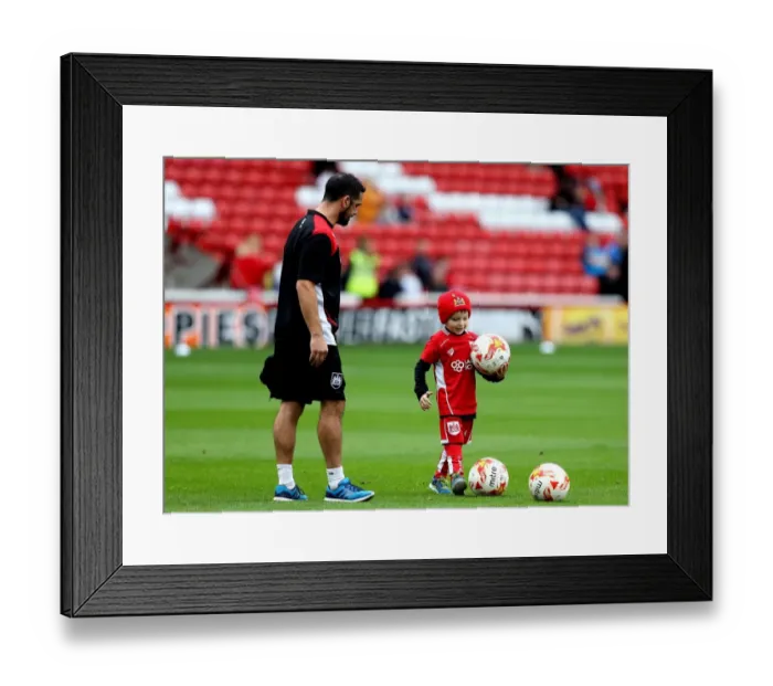 Framed Print : Young Bristol City Fan Helps Out at Oakwell Stadium During Barnsley vs. Bristol City Match Framed Print : Young Bristol City Fan Helps Out at Oakwell Stadium During Barnsley vs. Bristol City Match