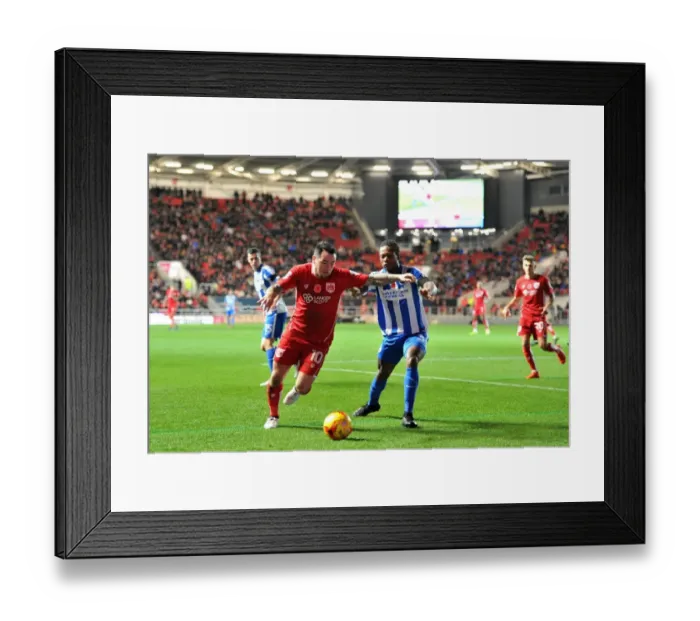 Framed Print : Championship Clash: Lee Tomlin vs Gaetan Bong - A Battle at Ashton Gate Framed Print : Championship Clash: Lee Tomlin vs Gaetan Bong - A Battle at Ashton Gate