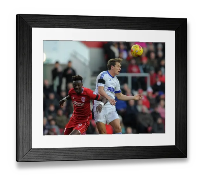 Framed Print : Bristol City vs Ipswich Town: Intense Battle Between Tammy Abraham and Christophe Berra