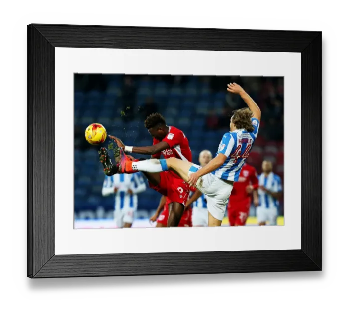 Framed Print : Huddersfield's Hefele Holds Off Abraham in Championship Showdown Framed Print : Huddersfield's Hefele Holds Off Abraham in Championship Showdown