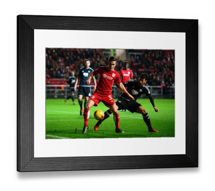 Framed Print : Bristol City's Joe Bryan Holds Off Brentford's Maxime Colin during Sky Bet Championship Match Framed Print : Bristol City's Joe Bryan Holds Off Brentford's Maxime Colin during Sky Bet Championship Match