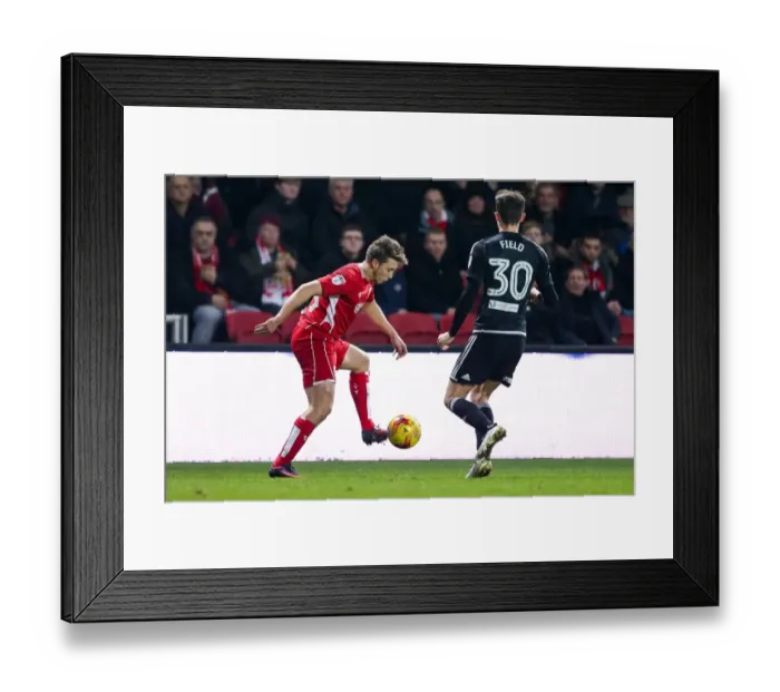 Framed Print : Bristol City vs Brentford: Luke Freeman vs Tom Field - Intense Championship Clash at Ashton Gate