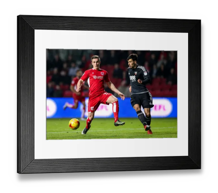 Framed Print : Bristol City vs Brentford: Joe Bryan vs Maxime Colin Clash in Championship Showdown Framed Print : Bristol City vs Brentford: Joe Bryan vs Maxime Colin Clash in Championship Showdown