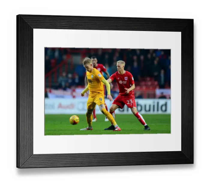 Framed Print : Hordur Magnusson Closes In: Intense Moment from Bristol City vs Preston North End