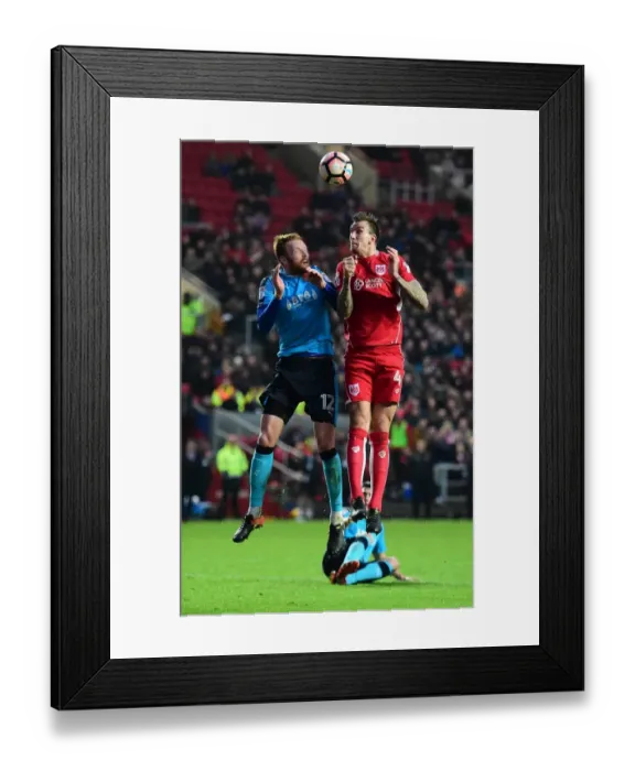 Framed Print : Battling for Supremacy: Aden Flint vs. Cian Bolger in the FA Cup Clash between Bristol City and Fleetwood Town