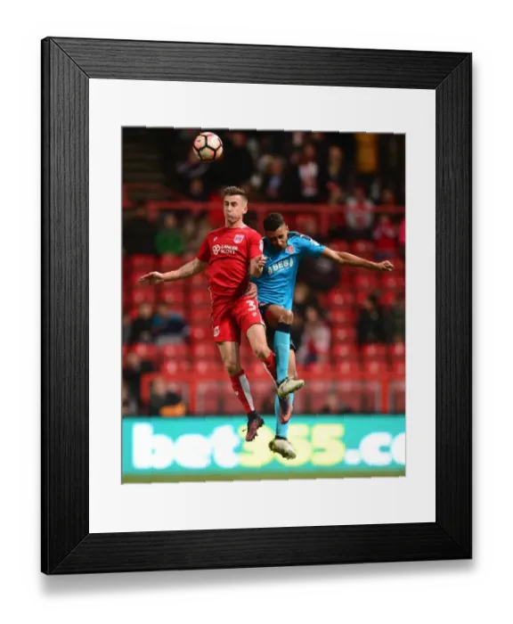 Framed Print : Bristol City's Joe Bryan Wins Aerial Battle Against Fleetwood Town in FA Cup Third Round Framed Print : Bristol City's Joe Bryan Wins Aerial Battle Against Fleetwood Town in FA Cup Third Round