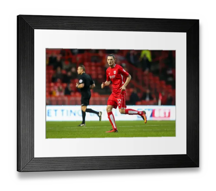 Framed Print : Milan Djuric of Bristol City Ponders Next Move at Ashton Gate Stadium during FA Cup Third Round Match against Fleetwood Town Framed Print : Milan Djuric of Bristol City Ponders Next Move at Ashton Gate Stadium during FA Cup Third Round Match against Fleetwood Town