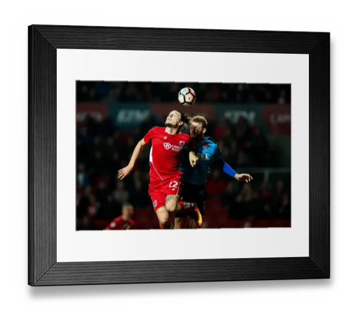 Framed Print : Clash in the Air: Milan Djuric vs. Cian Bolger - Bristol City vs. Fleetwood Town, FA Cup Third Round