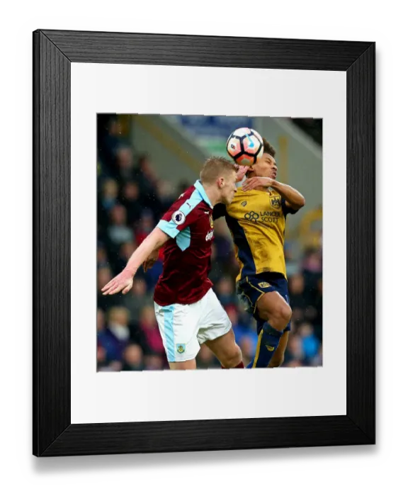 Framed Print : Bobby Reid vs Scott Arfield: Clash at Turf Moor, FA Cup Fourth Round Framed Print : Bobby Reid vs Scott Arfield: Clash at Turf Moor, FA Cup Fourth Round