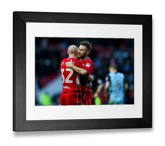 Framed Print : Bristol City Celebrates 1-0 Win: New Signings Cotterill and Taylor Embrace Framed Print : Bristol City Celebrates 1-0 Win: New Signings Cotterill and Taylor Embrace