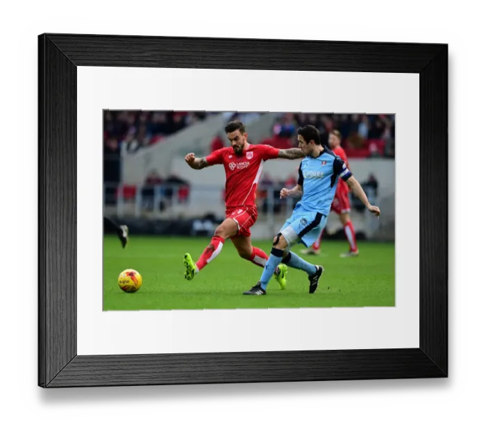 Framed Print : Maron Pack vs Richard Wood: Intense Battle for Ball at Ashton Gate