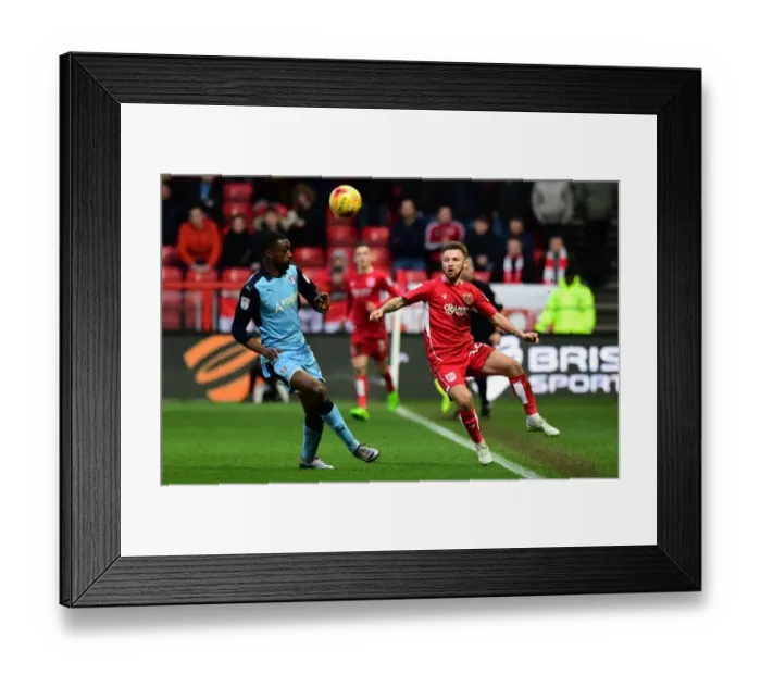 Framed Print : Determined Clash: Matty Taylor vs Semi Ajayi at Ashton Gate Framed Print : Determined Clash: Matty Taylor vs Semi Ajayi at Ashton Gate