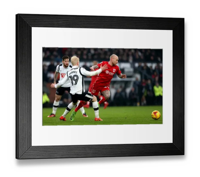 Framed Print : David Cotterill Outmaneuvers Will Hughes: Intense Championship Showdown between Derby County and Bristol City