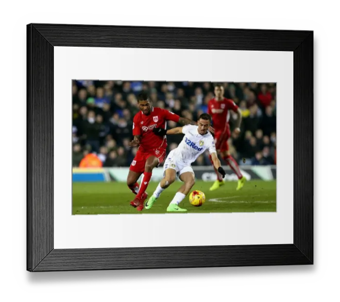 Framed Print : Mark Little vs Kemar Roofe: Intense Moment at Elland Road during Leeds United vs Bristol City Championship Clash