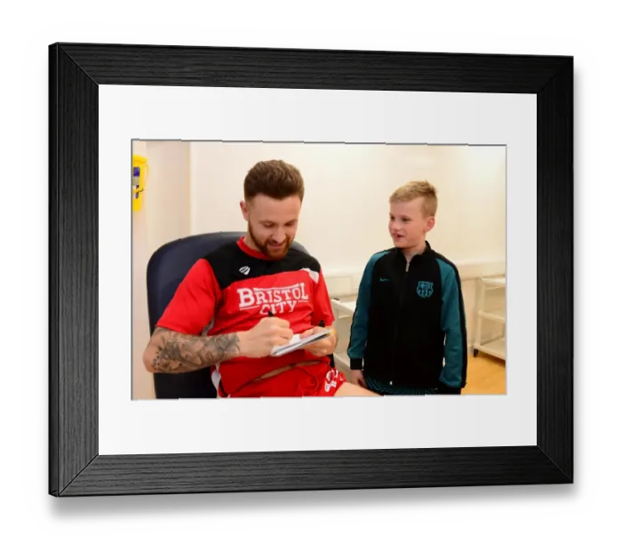 Framed Print : Bristol City's Matty Taylor Greets Mascot Before Fulham Clash Framed Print : Bristol City's Matty Taylor Greets Mascot Before Fulham Clash