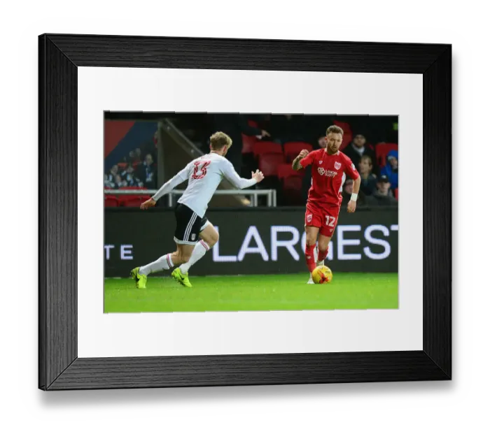 Framed Print : Bristol City's Matty Taylor Charges Forward Against Fulham in Sky Bet Championship Clash