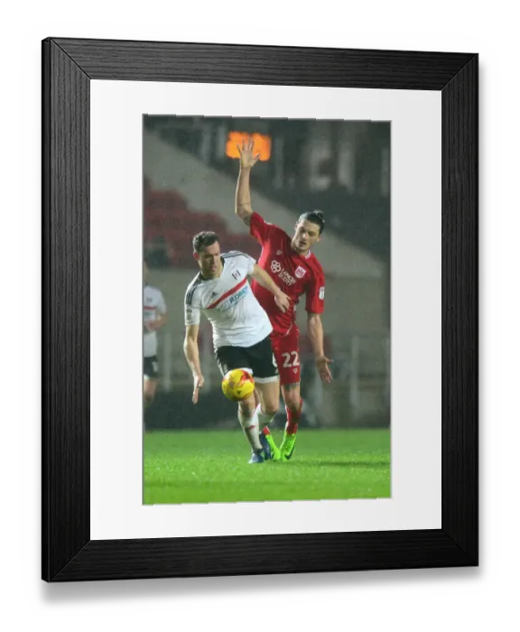 Framed Print : Milan Djuric of Bristol City Clashes with Kevin McDonald of Fulham in Sky Bet Championship Match