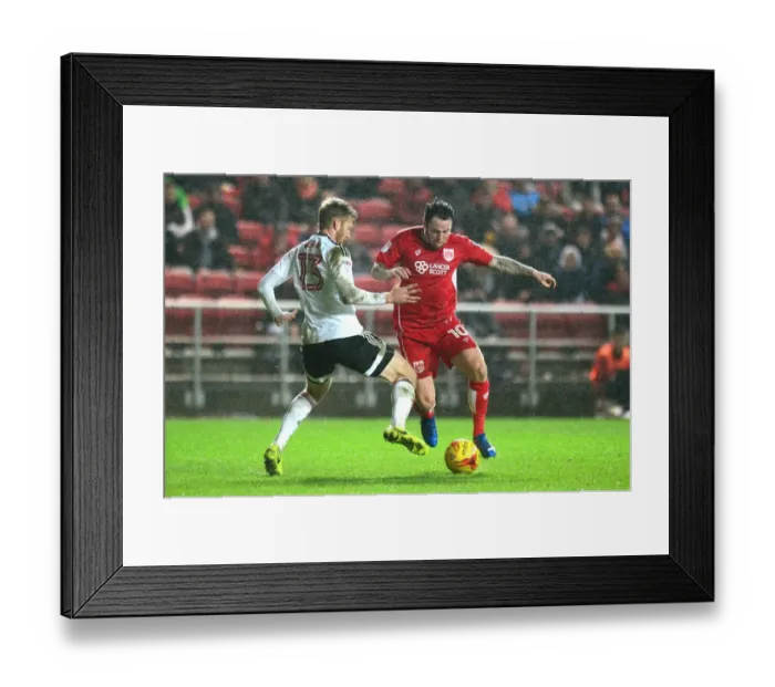 Framed Print : Bristol City vs Fulham: Intense Moment as Lee Tomlin Fights for the Ball against Tim Ream
