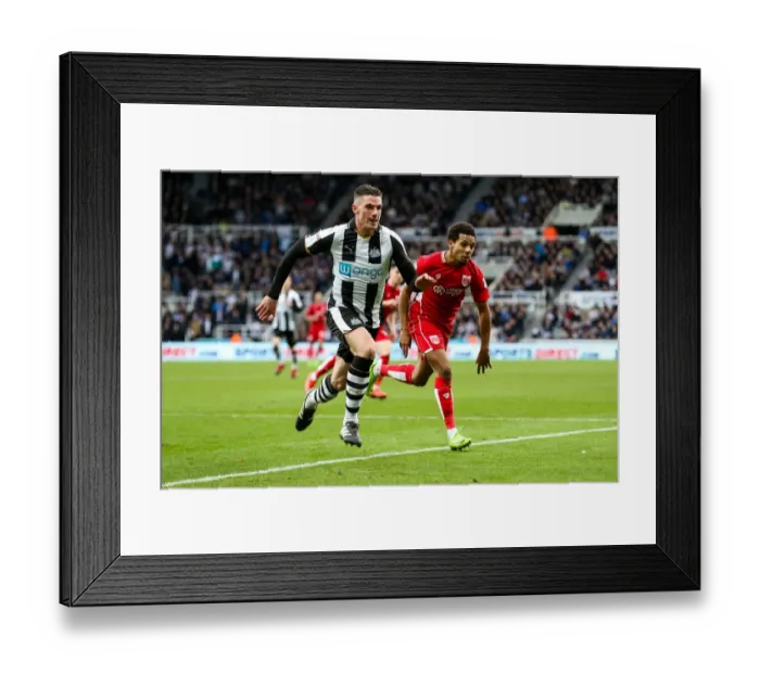 Framed Print : Clash at St. James Park: Ciaran Clark and Korey Smith Battle it Out