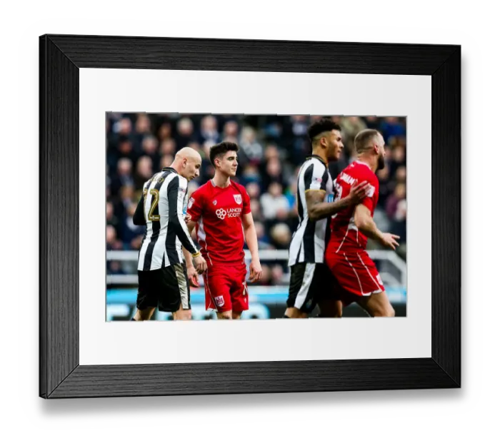 Framed Print : Shelvey vs. O'Dowda: Intense Rivalry at St James Park