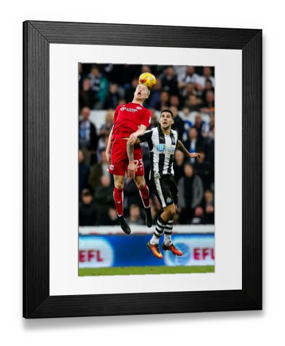 Framed Print : Clash in the Air: Hordur Magnusson vs. Aleksandar Mitrovic - Newcastle United vs. Bristol City, 2017