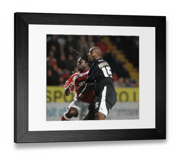 Framed Print : Dele Adebola tussles for the ball with Charltons Linvoy Primus Framed Print : Dele Adebola tussles for the ball with Charltons Linvoy Primus