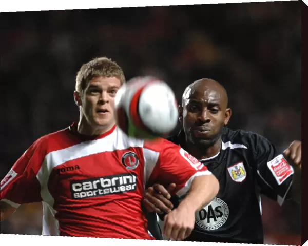 Dele Adebola chases Charltons Martin Cranie for the ball