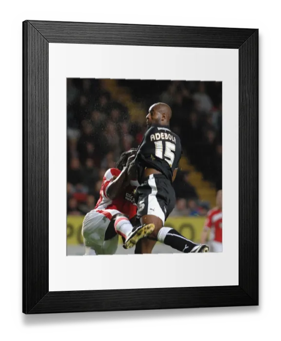 Framed Print : Dele Adebola vs Linvoy Primus: Intense Battle for the Ball (Charlton Athletic vs Bristol City)