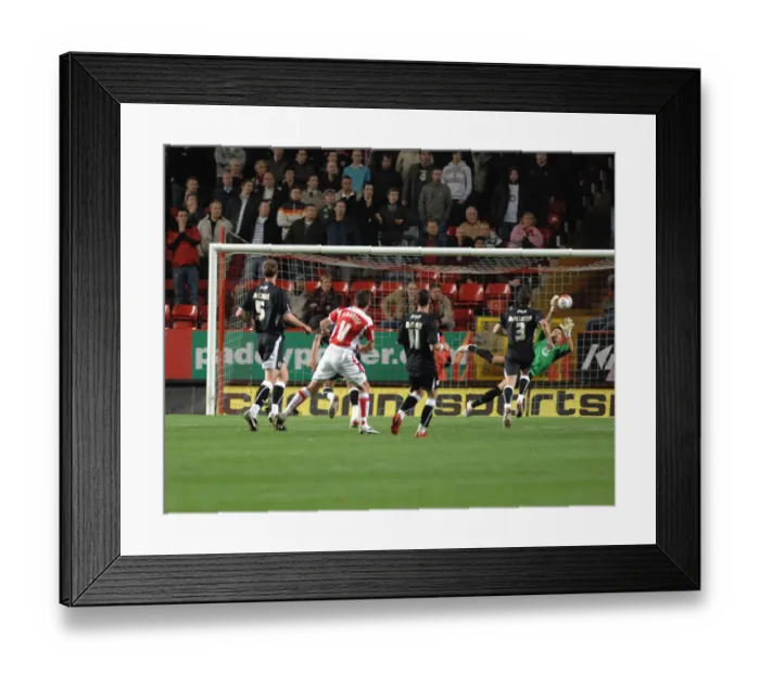 Framed Print : Adriana Bassoo saves well from a Darren Ambrose