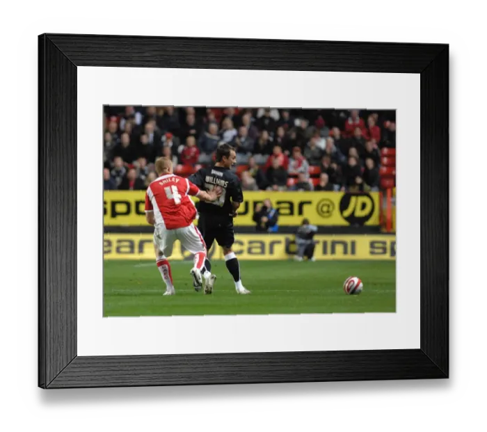 Framed Print : Gavin Williams backheels the ball past Charltons Nicky Baily Framed Print : Gavin Williams backheels the ball past Charltons Nicky Baily