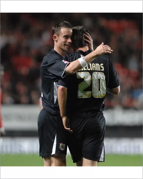 Michael McIndoe congratulates goalscorer Gavin Williams