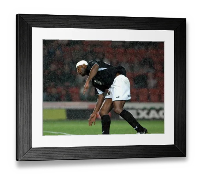 Framed Print : Dele Adebola challenges for the ball in