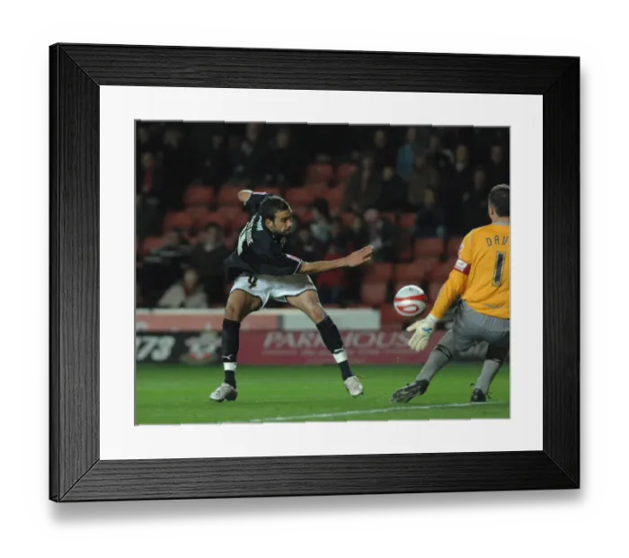 Framed Print : Liam Fontaine sees his shot saved by saints goalkeeper Kelvin Davies Framed Print : Liam Fontaine sees his shot saved by saints goalkeeper Kelvin Davies