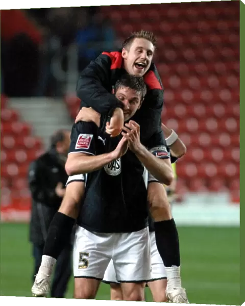 David Noble and Jamie McCombe celebrate on the final whistle