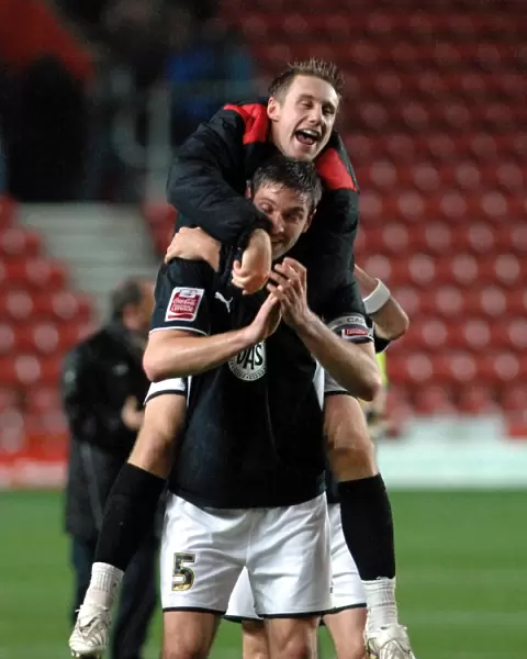 David Noble and Jamie McCombe celebrate on the final whistle