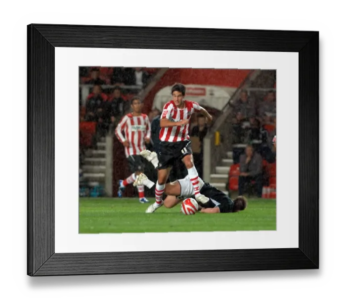 Framed Print : Saints midfielder andy surman escapes david noble after brushing him aside