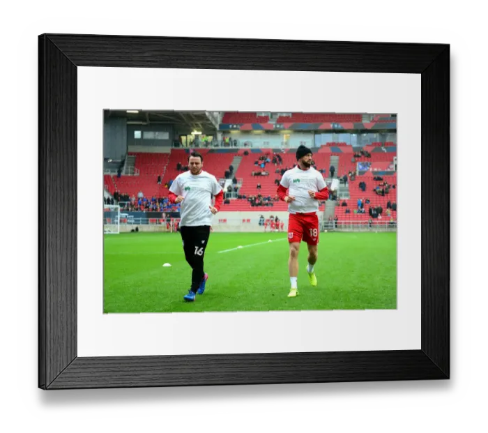 Framed Print : Bristol City Players Aaron Wilbraham and Lee Tomlin Show Support for Children's Hospice South West during Sky Bet Championship Match against Burton Albion