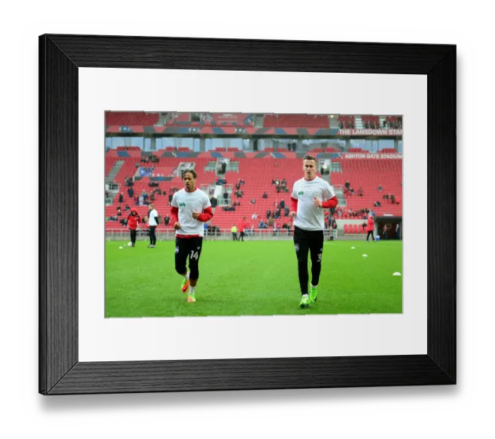 Framed Print : Bristol City Players Bobby Reid and Joe Bryan Show Support for Children's Hospice South West during Match against Burton Albion Framed Print : Bristol City Players Bobby Reid and Joe Bryan Show Support for Children's Hospice South West during Match against Burton Albion