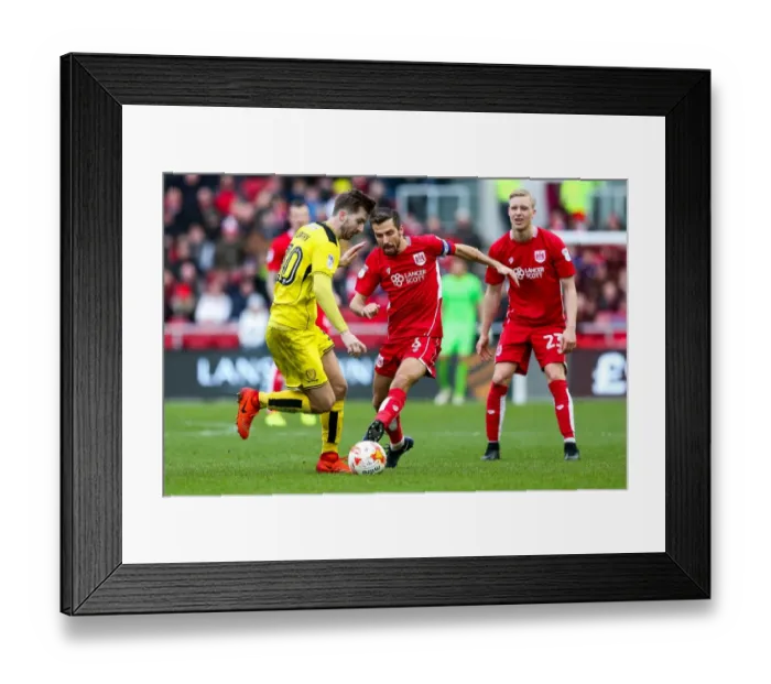 Framed Print : Bristol City vs Burton Albion: Gary O'Neil Tackled by Luke Murphy Framed Print : Bristol City vs Burton Albion: Gary O'Neil Tackled by Luke Murphy