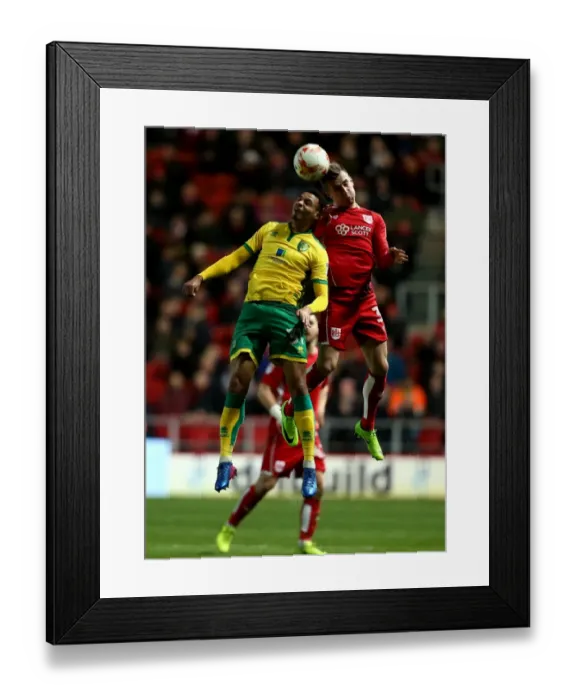 Framed Print : Bristol City's Joe Bryan Outjumps Norwich City's Josh Murphy for a Header at Ashton Gate