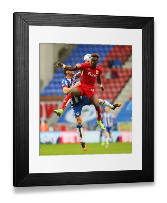 Framed Print : Intense Rivalry: Abraham vs Buxton at DW Stadium - Wigan Athletic vs Bristol City, Sky Bet Championship
